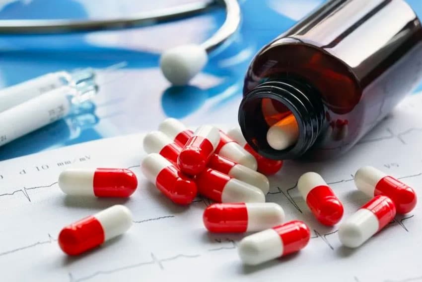 bottle of pills falling out of a bottle