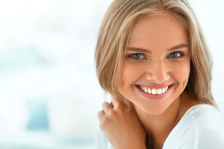 woman showing off her unique smile