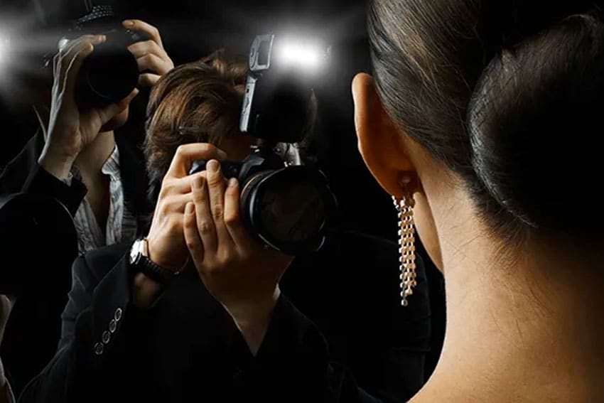 camera taking a picture of a celebrity