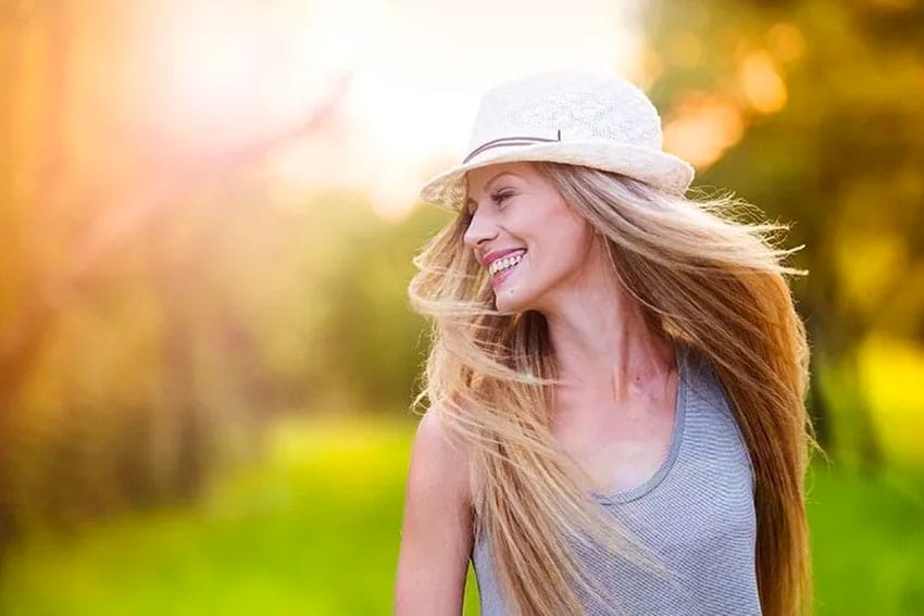 woman enjoying the beautiful sunshine outdoors