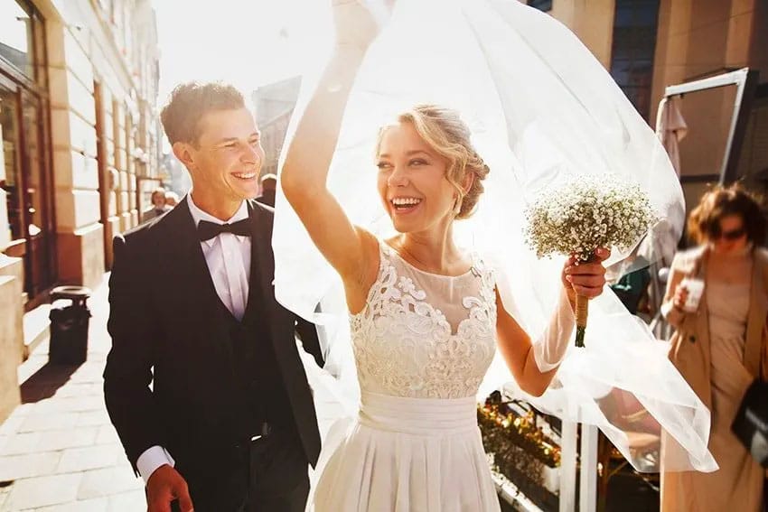 excited bride and groom on their wedding day