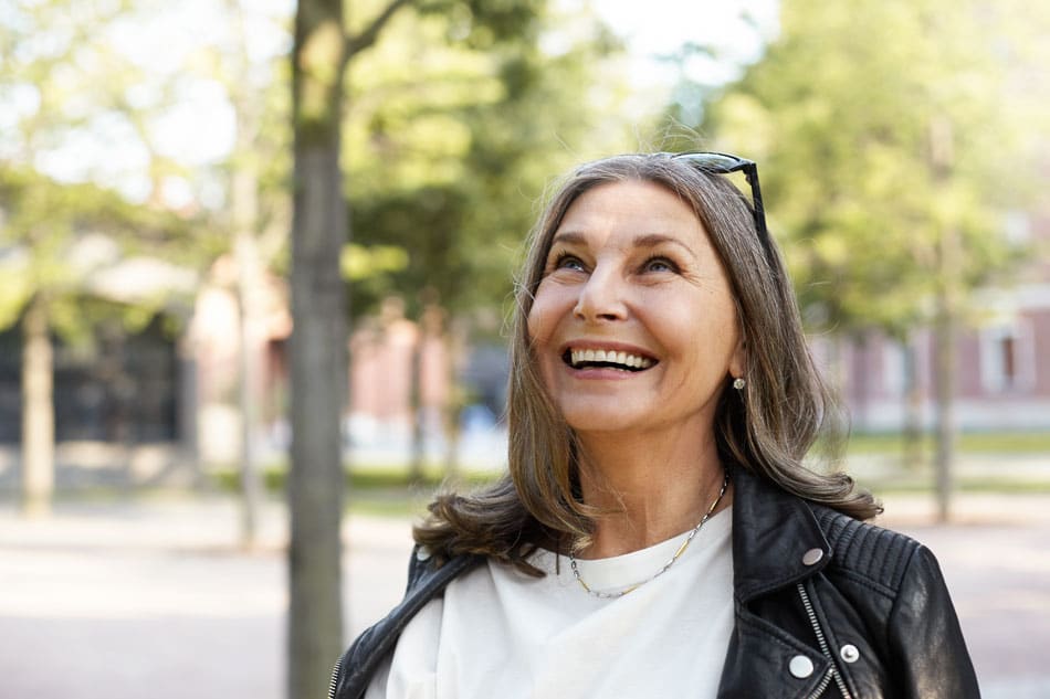 senior woman outside smiling