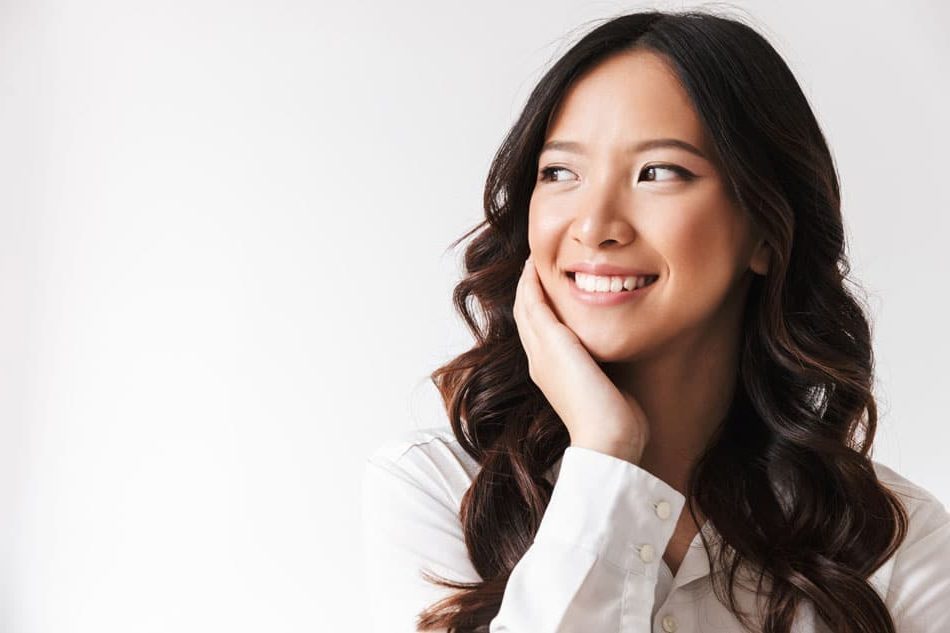 woman looking off to the side smiling