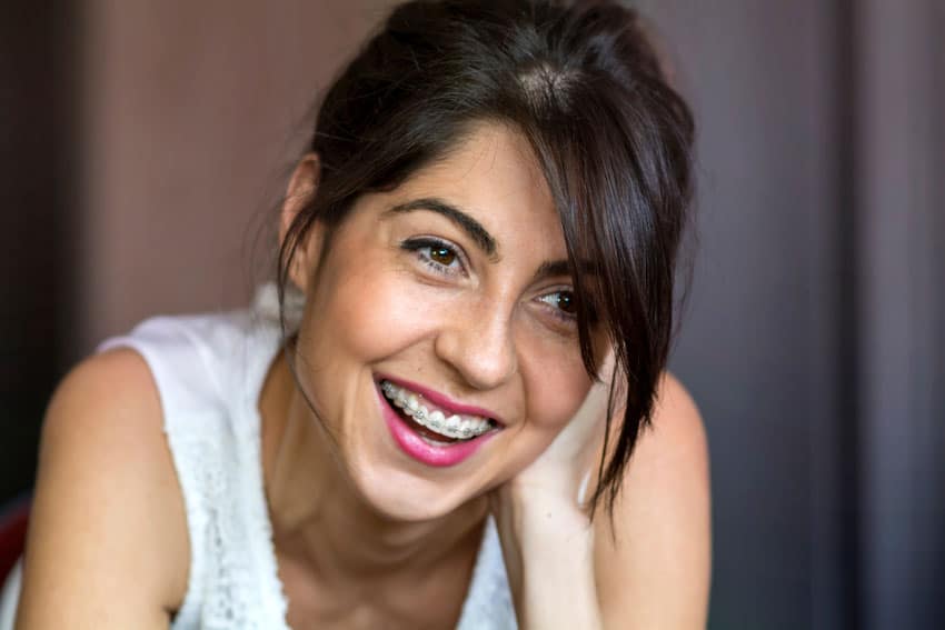adult woman smiling with braces