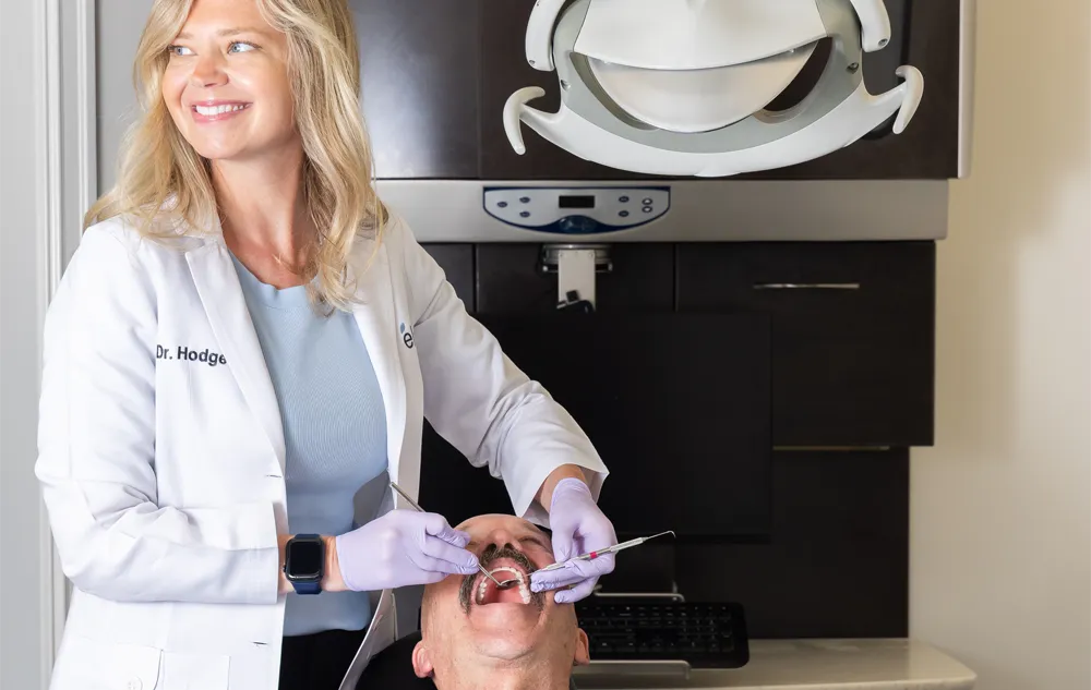 Dr. Meghan Hodges Performing A Dental Cleaning And Exam For A Patient At élan Tulsa Cosmetic Dentistry In Tulsa, Oklahoma