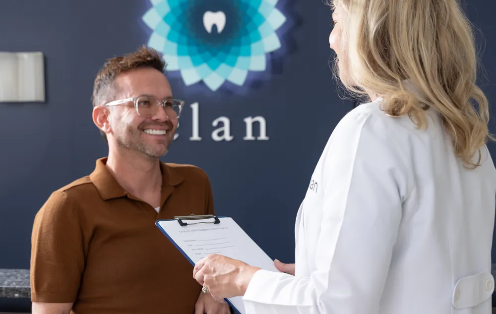 Dr. Meghan Hodges With A Smiling Patient During A Dental Appointment At élan Tulsa Cosmetic Dentistry In Tulsa, Oklahoma