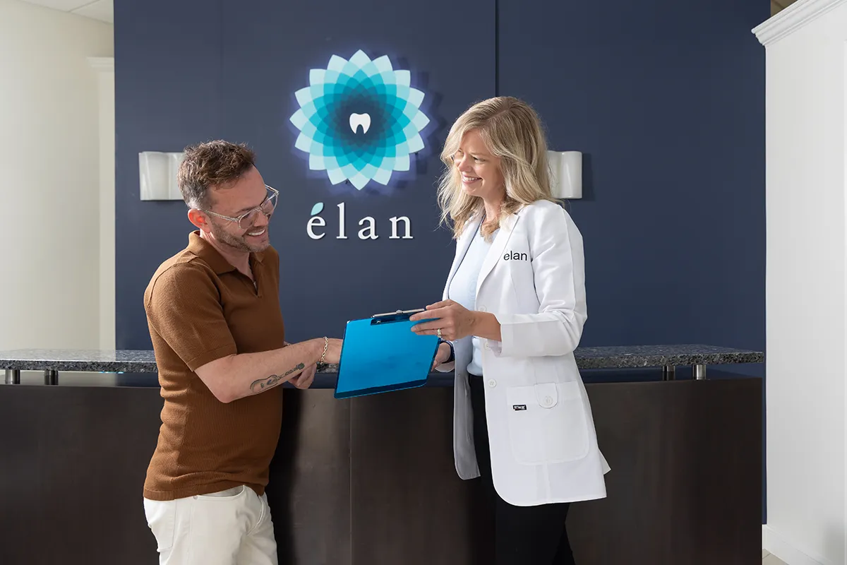 Doctor Hodges With Patient at elan Tulsa Cosmetic Dentistry Front Office