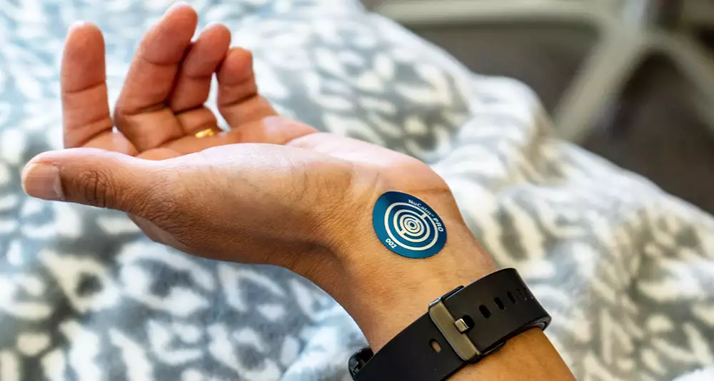 NuCalm Relaxation Biosignal Device Applied To The Wrist At élan Tulsa Cosmetic Dentistry In Tulsa, Oklahoma