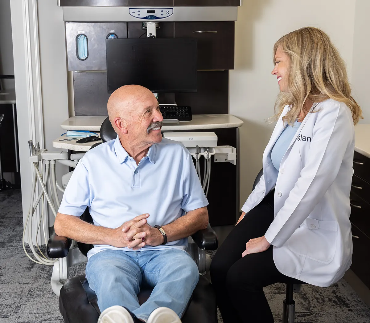 Full Mouth Dental Implant Dentist Dr. Hodges Talking With A Patient