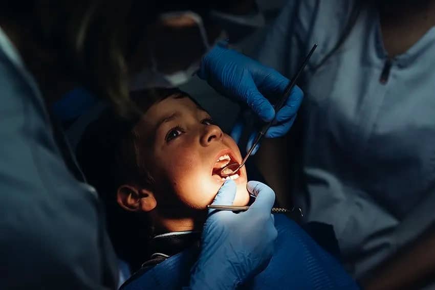 young child having his teeth checked