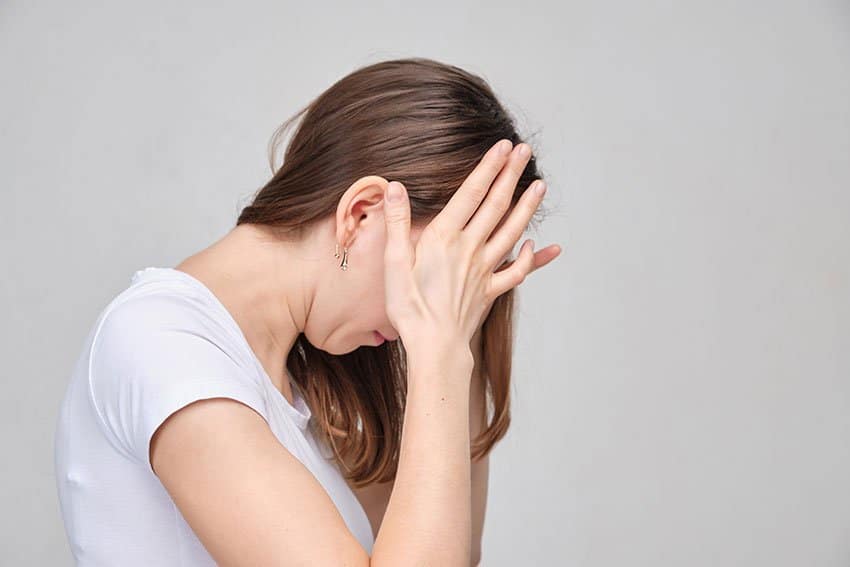 woman suffering from migraine headache