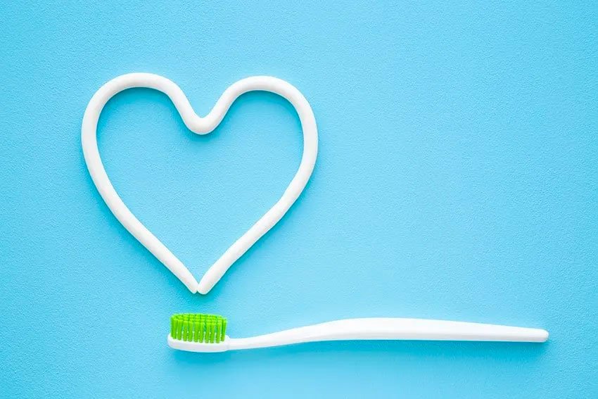 toothbrush with paste in the shape of a heart
