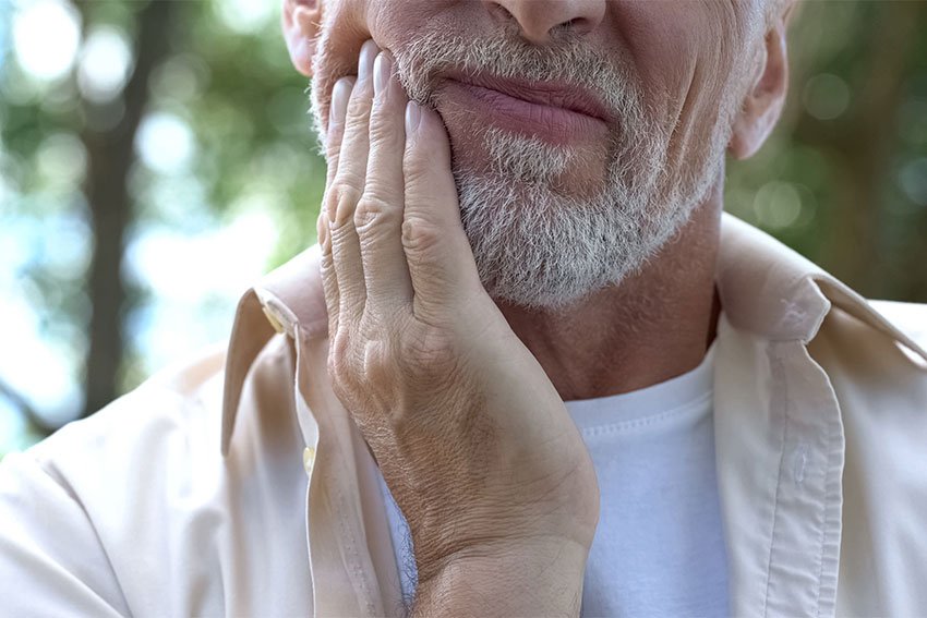 mature man with jaw pain