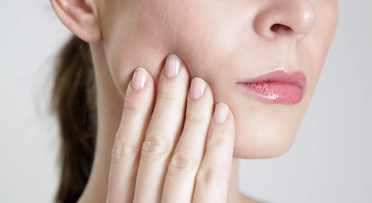 Woman Suffering From Jaw Pain